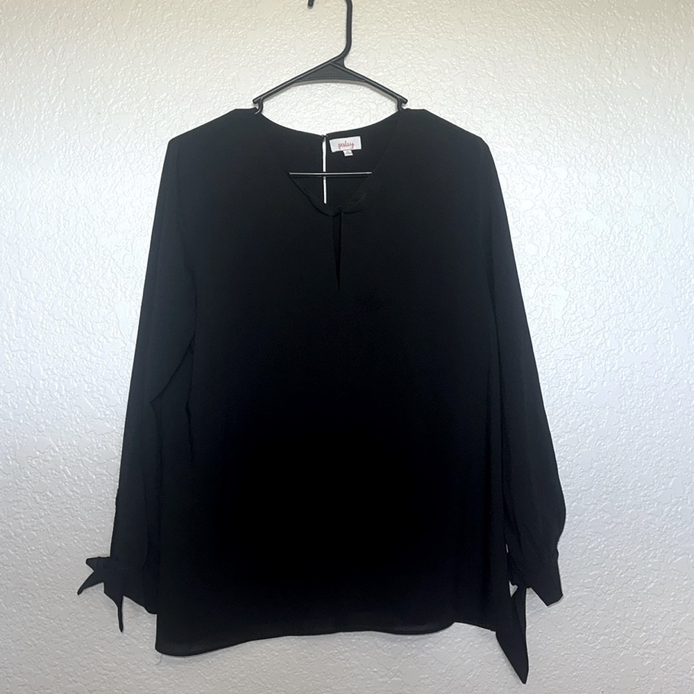 Black dress top with keyhole collar and tie sleeves.